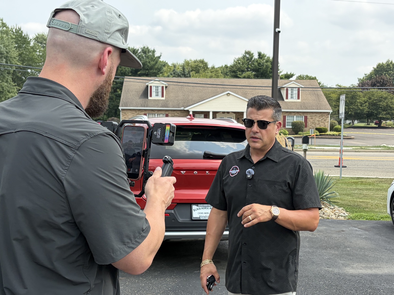 Phil at Black Horse Motors wearing a wireless clip-on mic