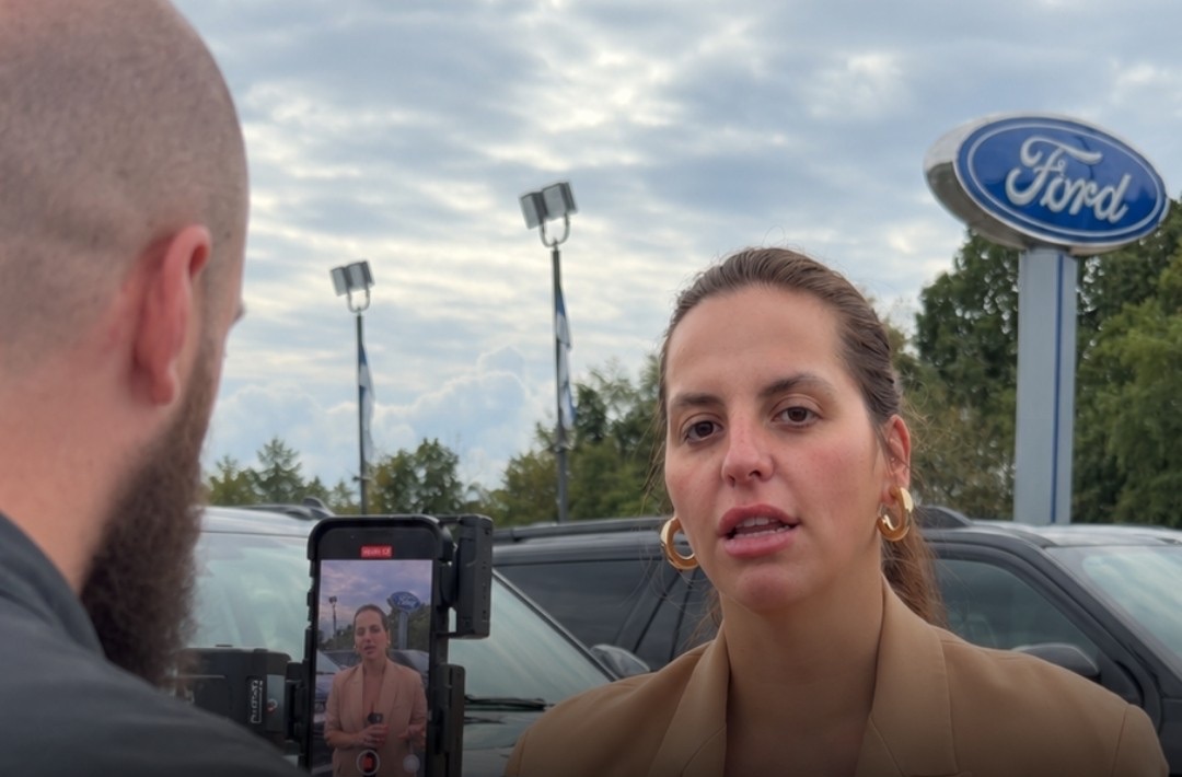 Josh filming an interview on a Ford lot